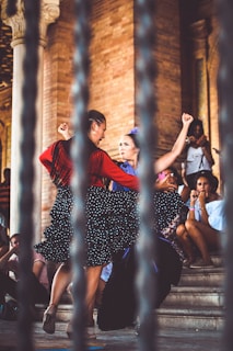 two women dancing outdoors