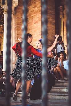 two women dancing outdoors