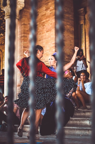 two women dancing outdoors