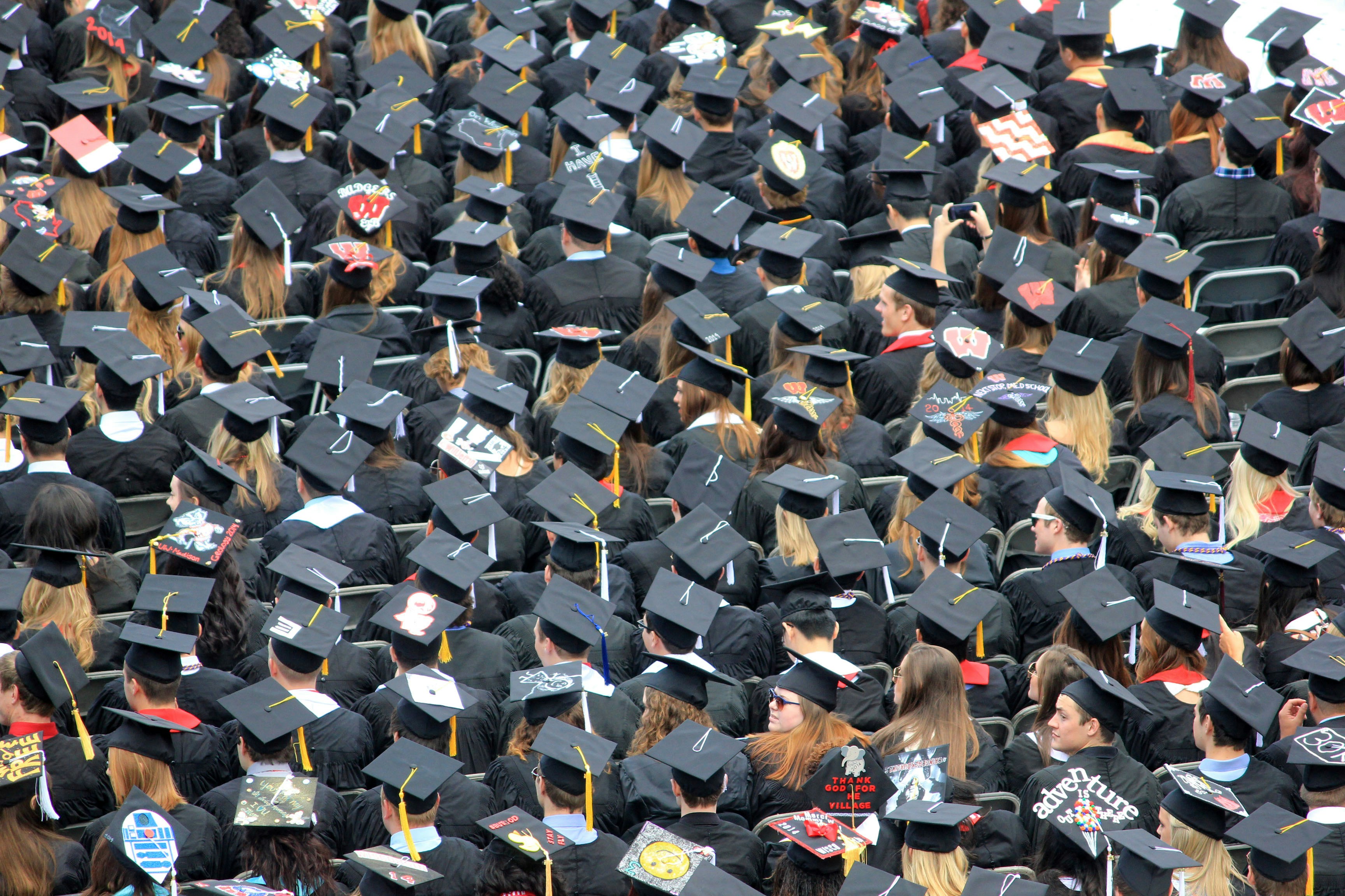 A see of college graduates at the commencement ceremony. If you use this photo, please consider crediting https://www.goodfreephotos.com , not required but always appreciated.