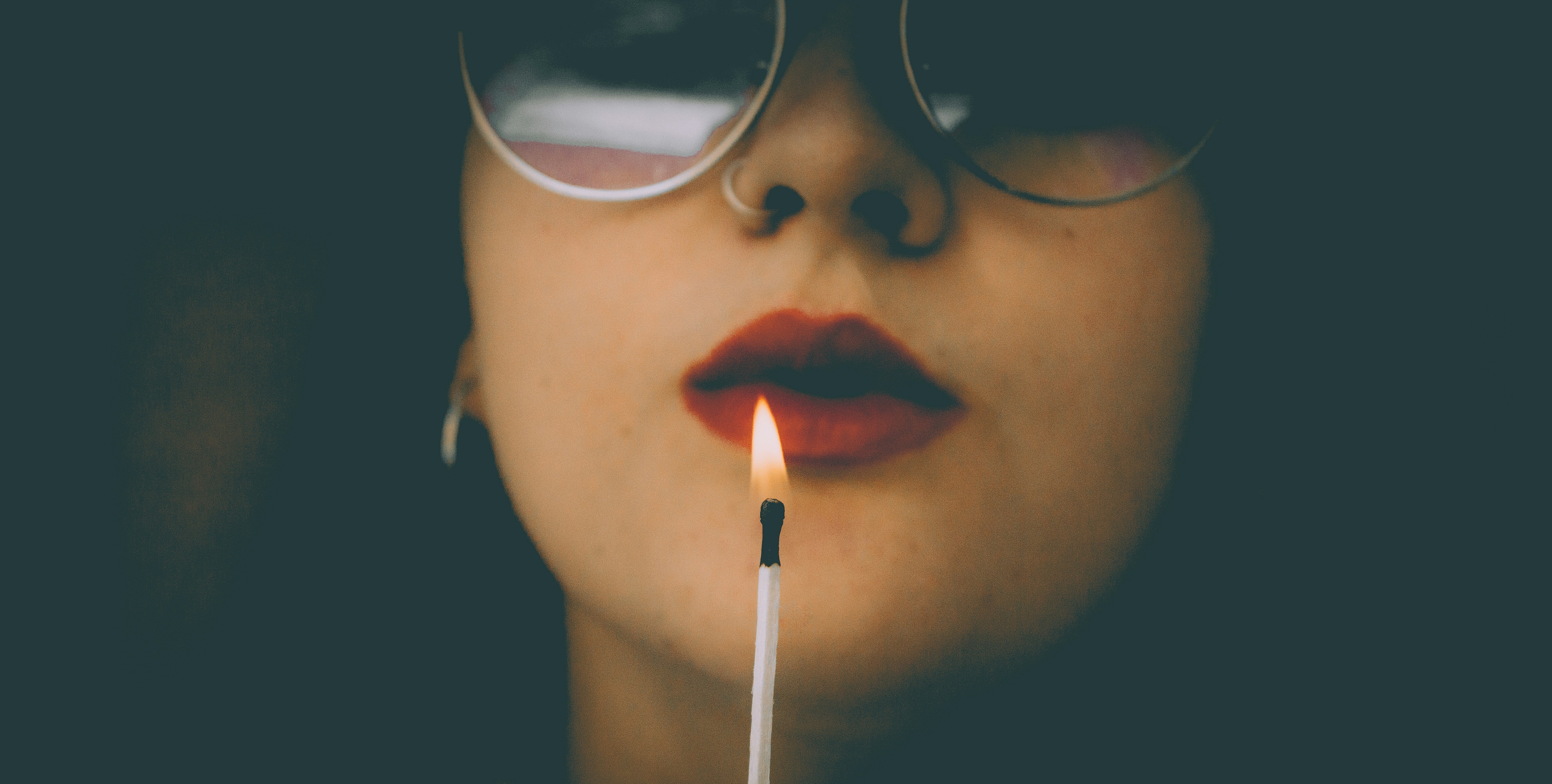 woman blowing candle, fire