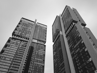 grayscale low-angle photography of concrete building
