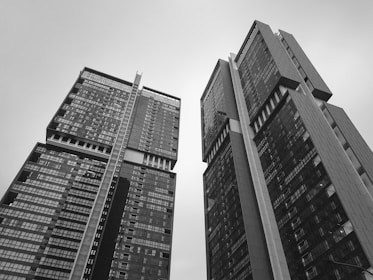 grayscale low-angle photography of concrete building