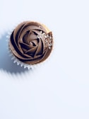chocolate cupcake on white surface