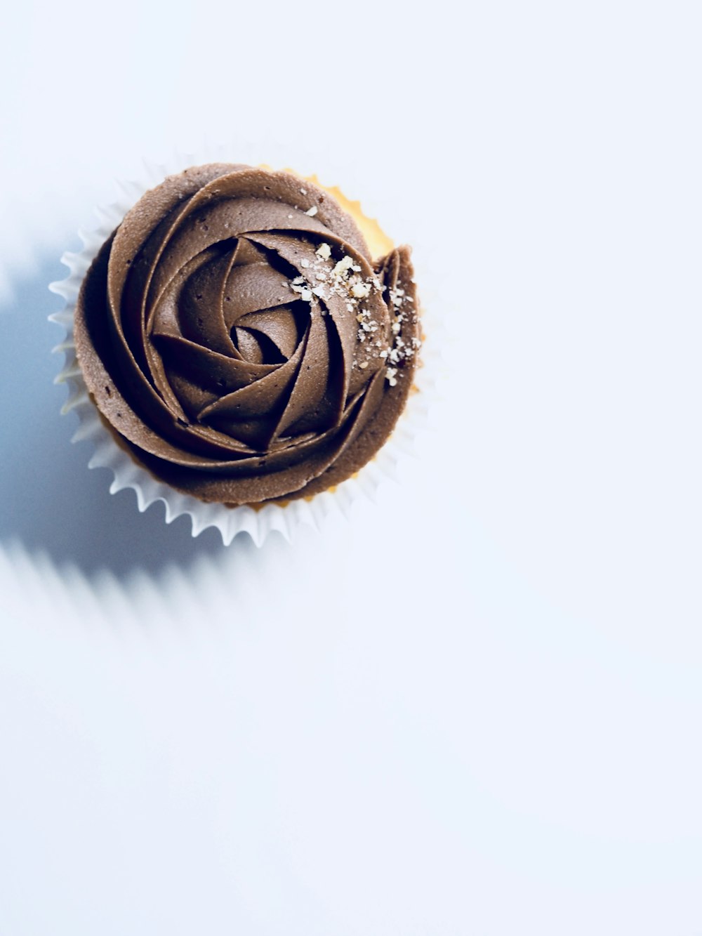 chocolate cupcake on white surface