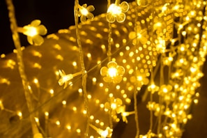 Festive garlands woven from natural fibers, glowing softly with warm fairy lights.