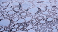 A panoramic view of frozen sea ice stretching towards the horizon near Kemi.