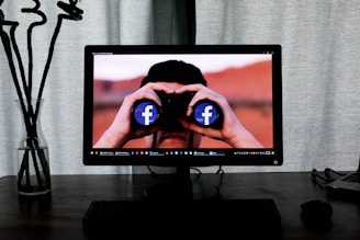 television showing man using binoculars