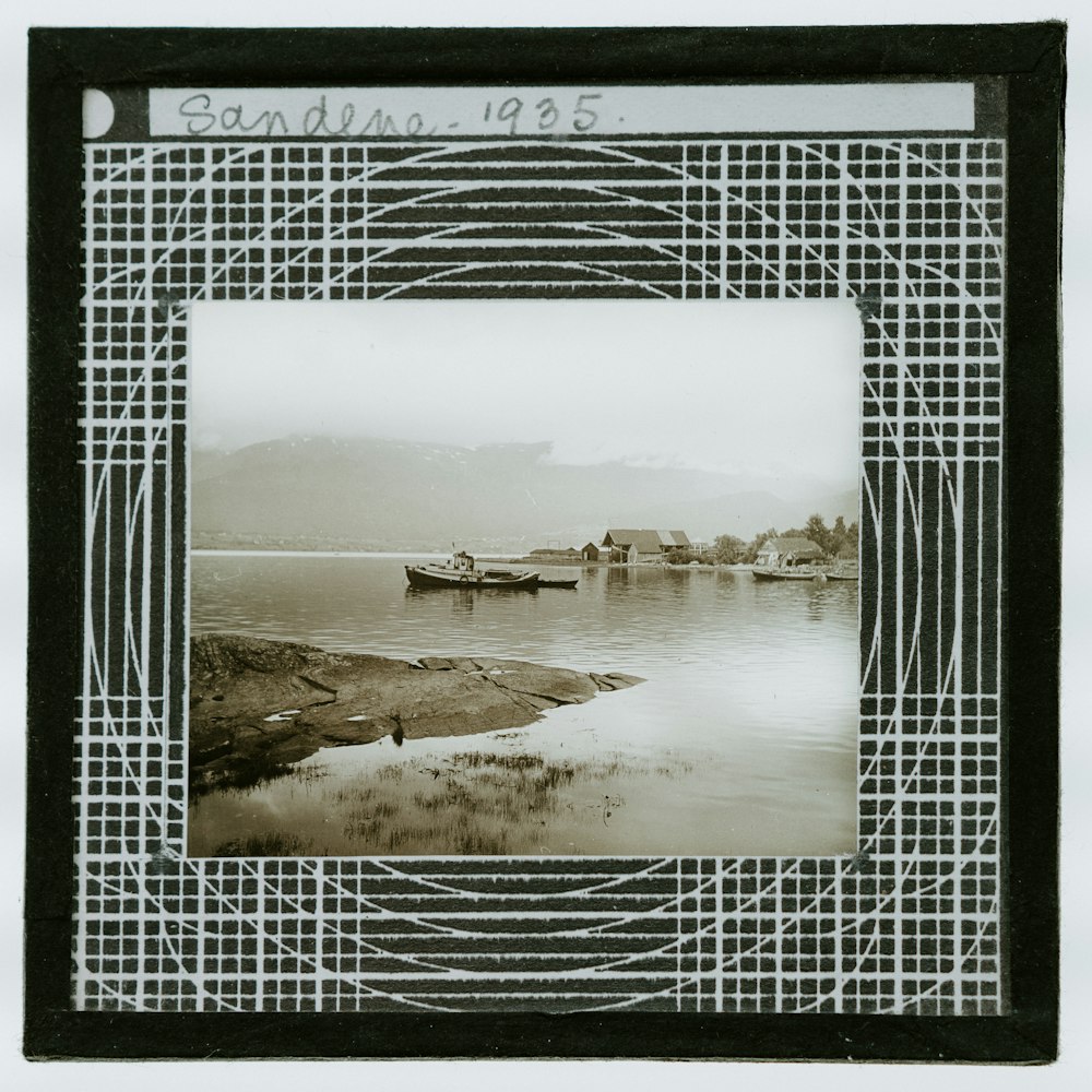 white and black boat on body of water