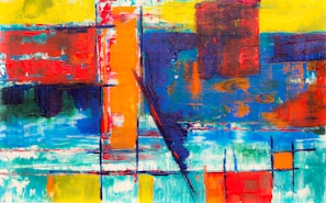 A colorful abstract painting with dynamic shapes and vibrant hues