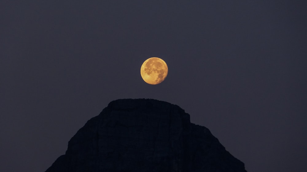 silhouette on mountain at night