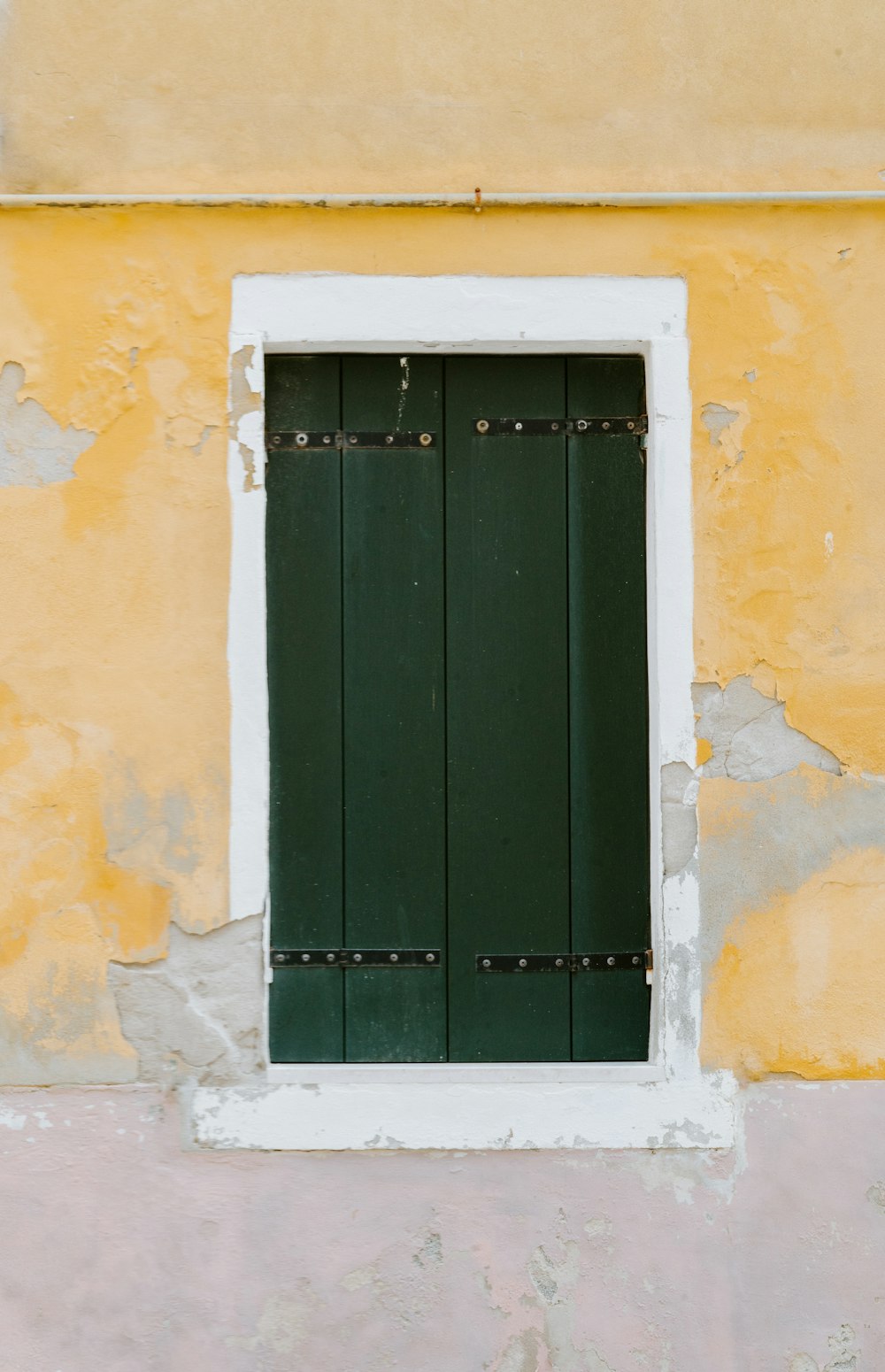 closed green wooden window