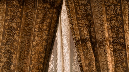 brown and black floral window curtain in Donnafugata Italy