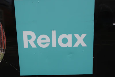A calming navy and teal rounded card with breathing exercise icons.