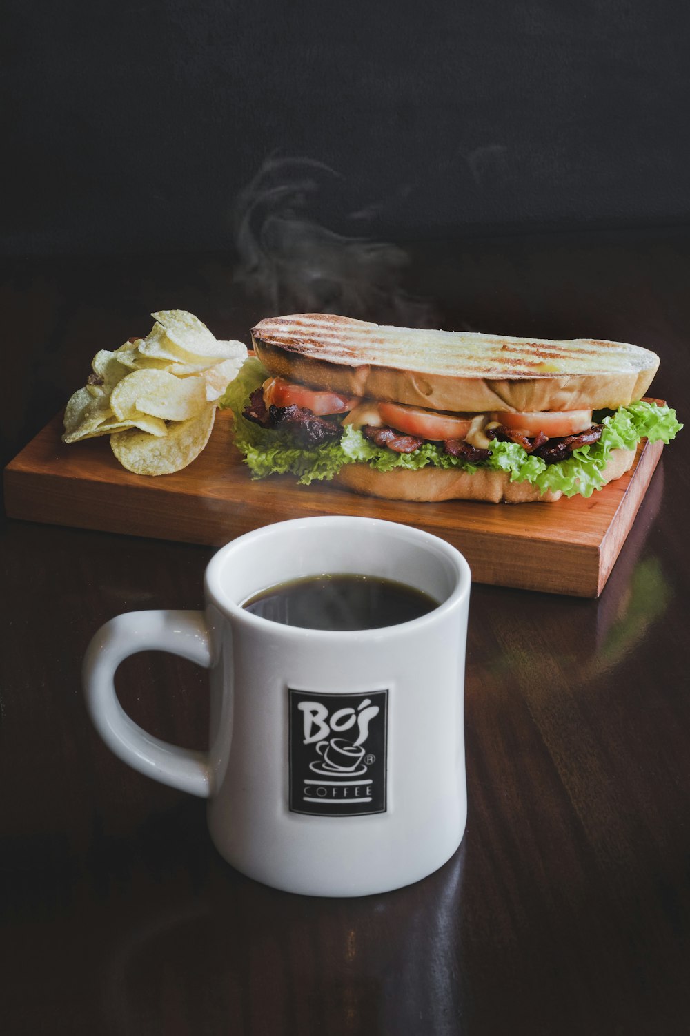 toasted bread with sliced tomatoes and coffee