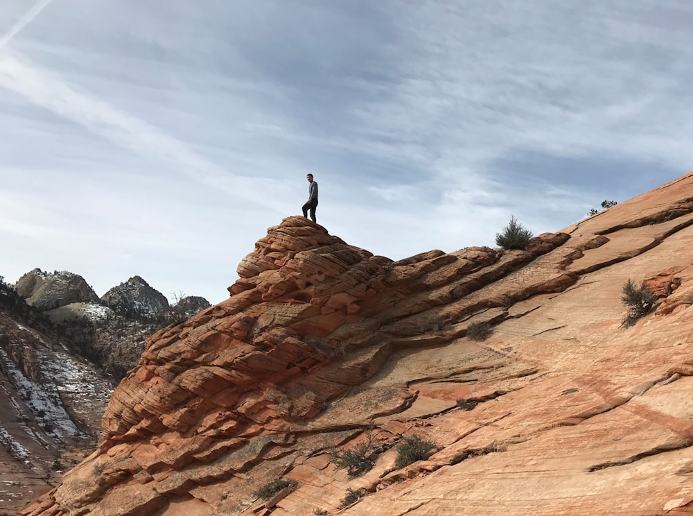 person standing on top of the mountain