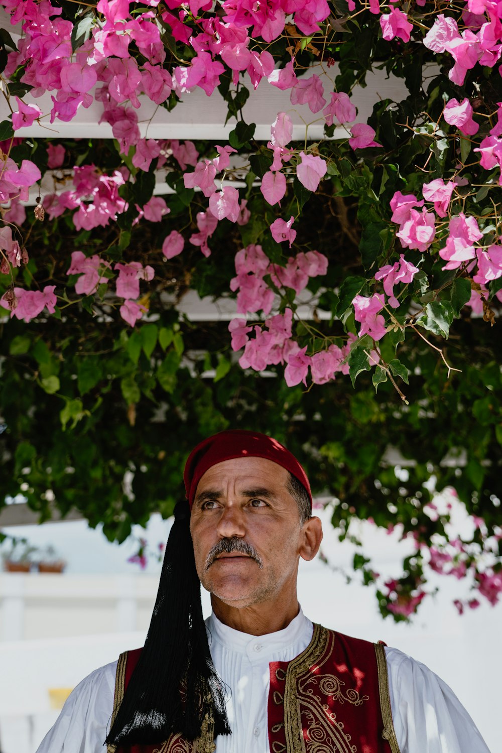 man wearing white and red top