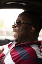 Happy customer smiling after windshield replacement.