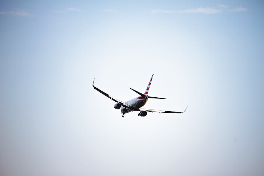 white airplane in flight