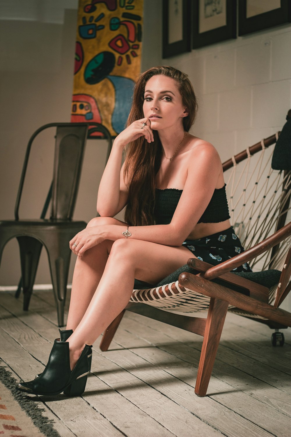 woman sitting on brown wooden framed bench