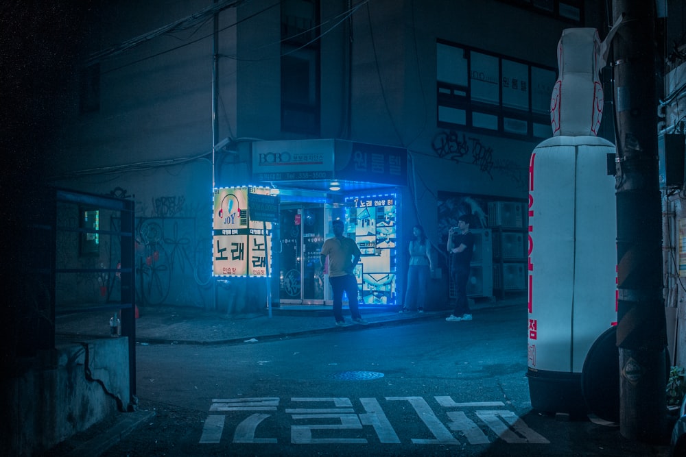 man standing in front of store