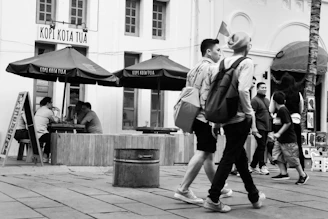 A cozy café terrace bustling with locals enjoying coffee and conversation in Kota Baru Parahyangan.