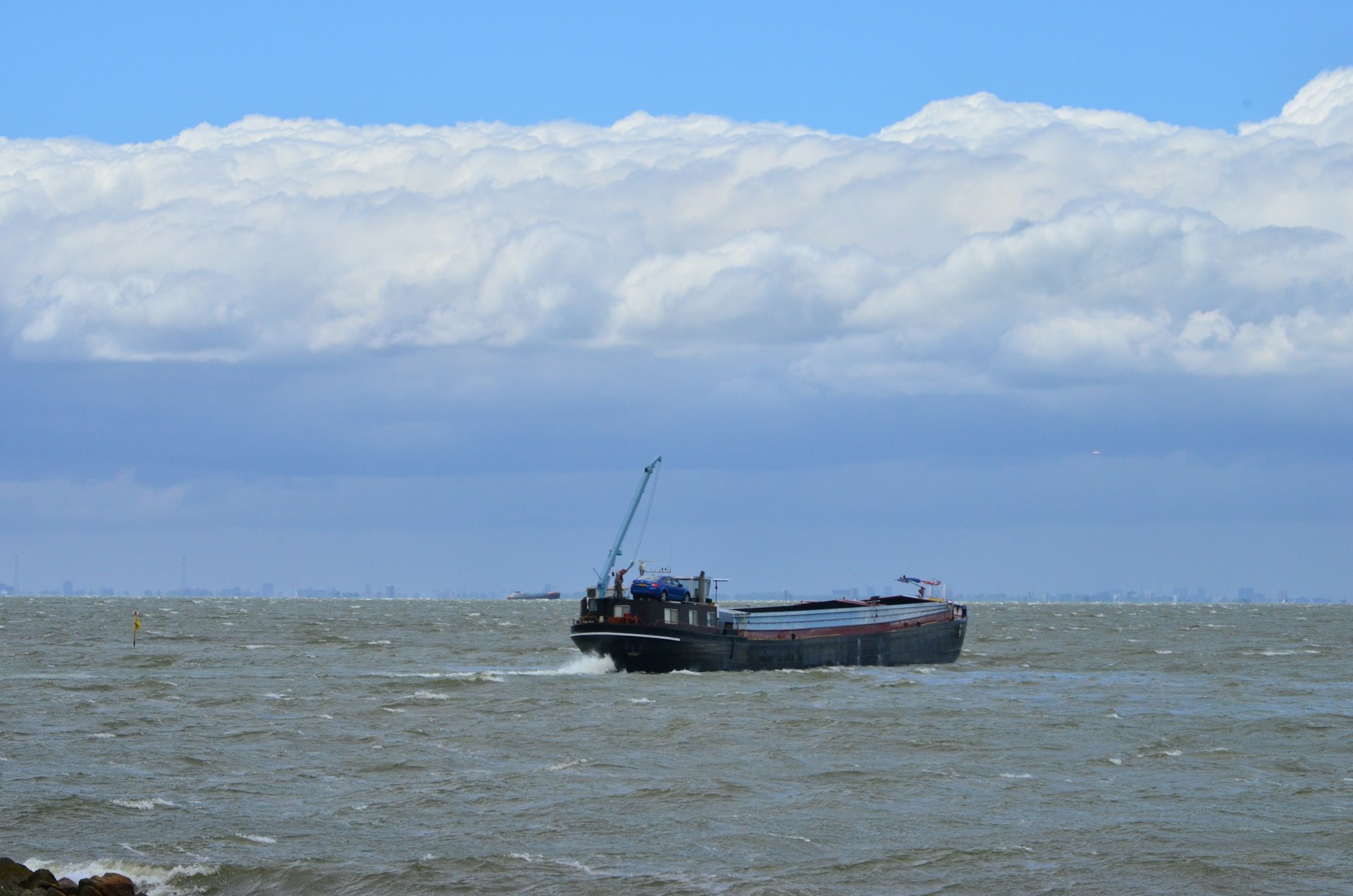 woman wearing yellow long-sleeved dress under white clouds and blue sky during daytime