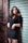 woman leaning on gray roller shutter