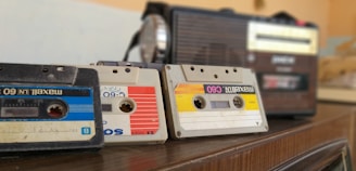 cassette tapes on brown wooden surface
