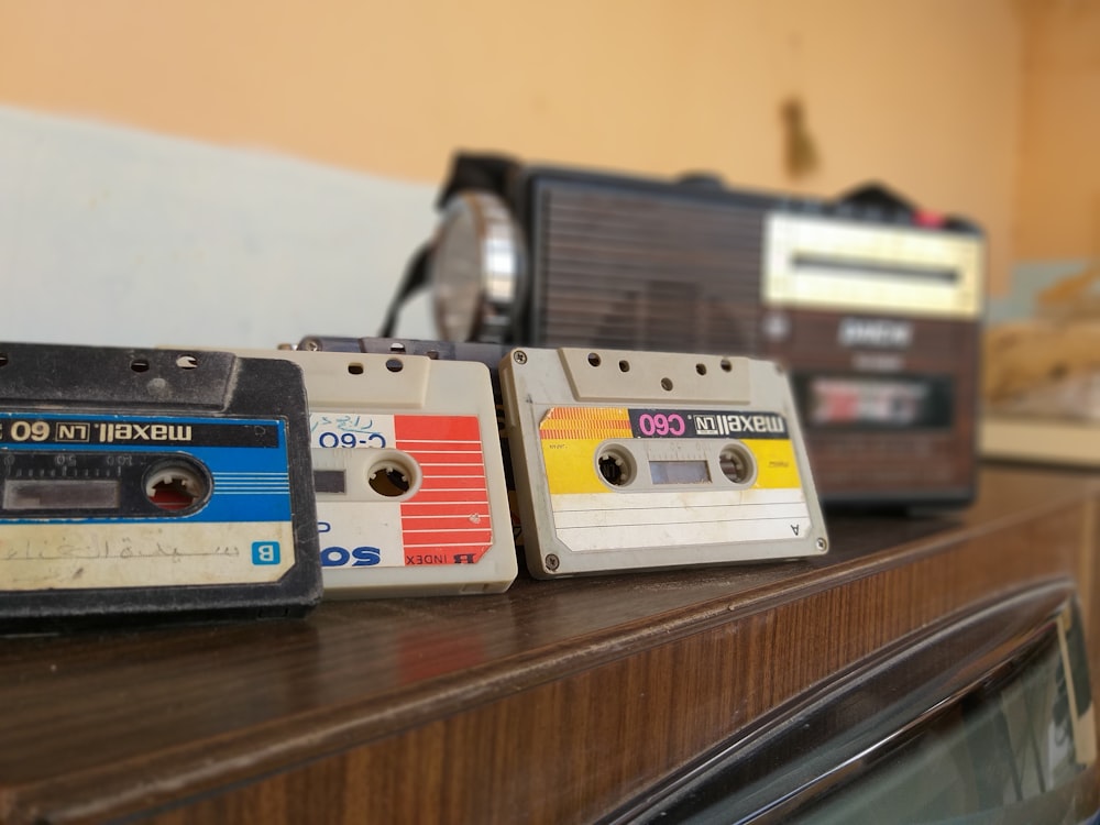 cassette tapes on brown wooden surface