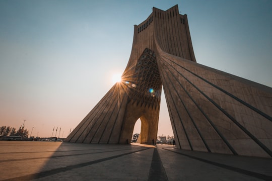 people near brown concrete structures in Azadi Tower Iran