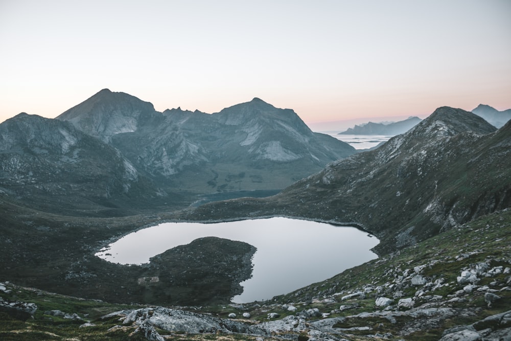 photo of mountains and body of water