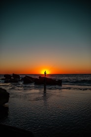 Fisherman hoping for the last catch of the day at sunset