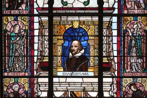 Portrait of William Shakespeare in classic Elizabethan attire, capturing his thoughtful gaze.