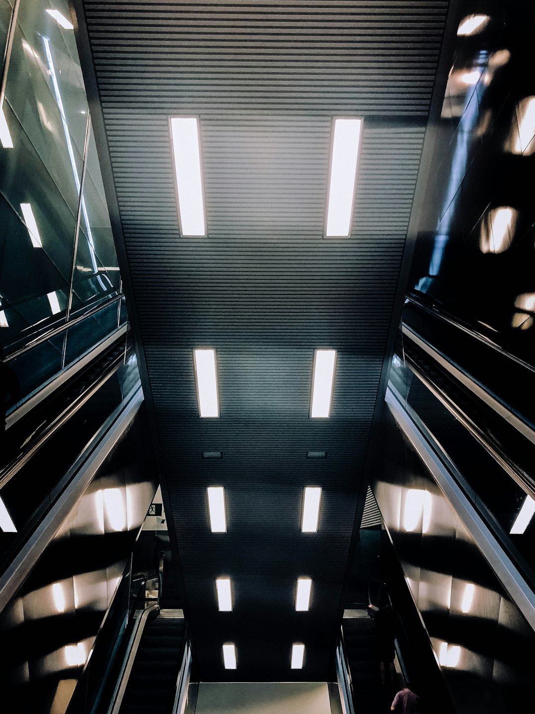 black and white escalator in a room