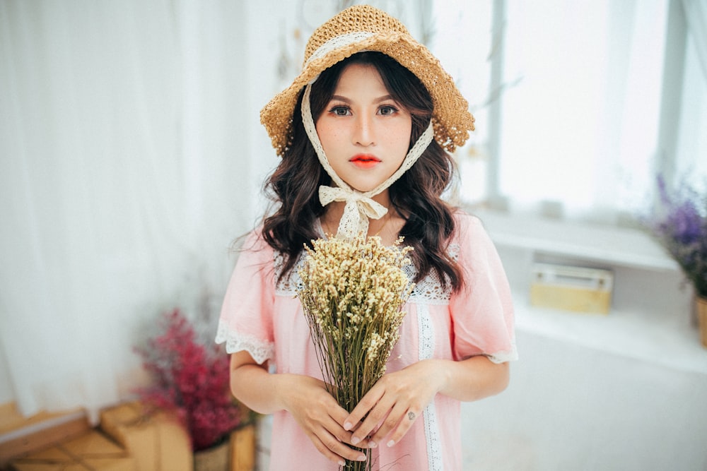 standing woman wearing pink dress