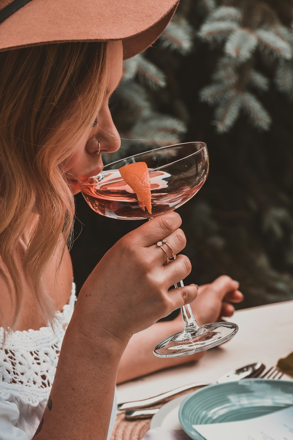 woman holding cocktail glass