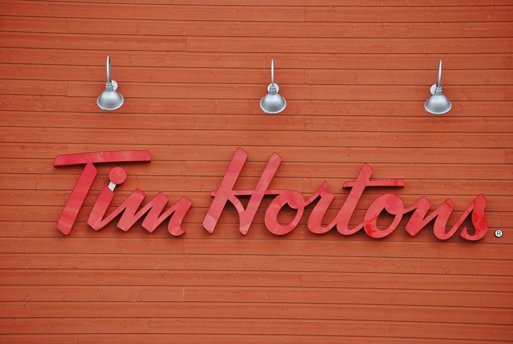 Tim Hortons signage under three gray lights