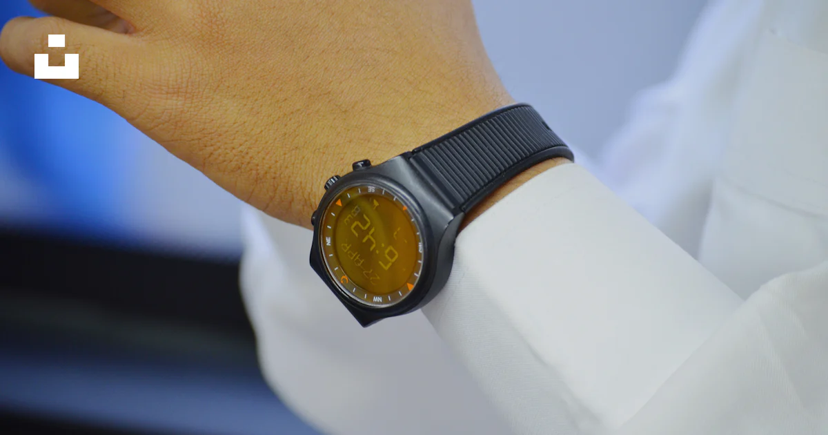 Reading Smartwatch Person wearing smartwatch reading at 6:42 photo – Free Time Image on ...