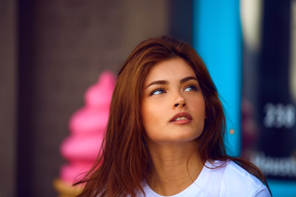 selective photography of woman in white crew-neck shirt