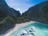 bird's eye view photography of boats in front of people gathered on seashore