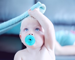 baby with pacifier in mouth