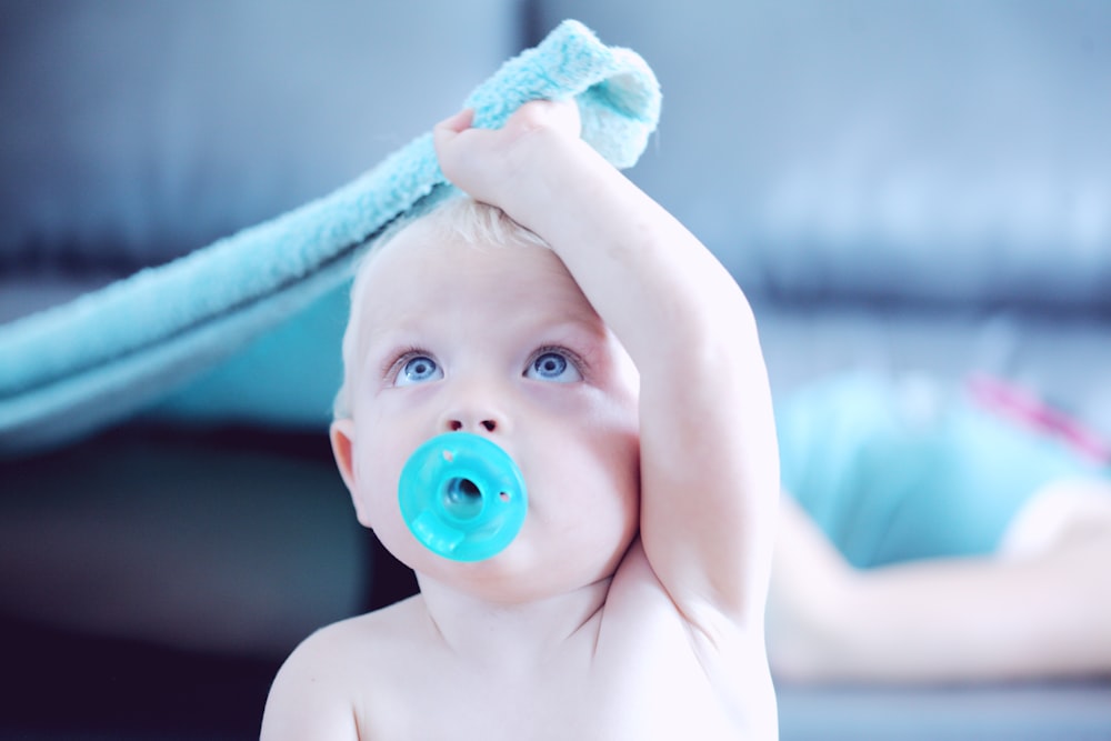 baby with pacifier in mouth