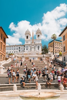 people gathering outside near cathedral during daytime