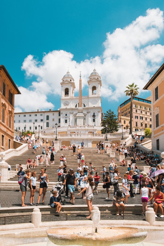 people gathering outside near cathedral during daytime in Spanish Steps Italy