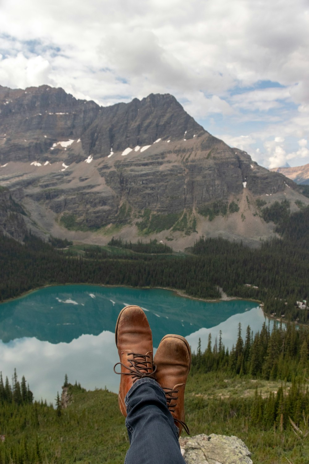 person showing brown dress shoes