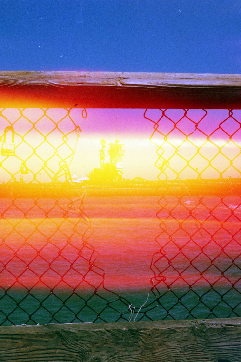 silhouette photo of mesh fence