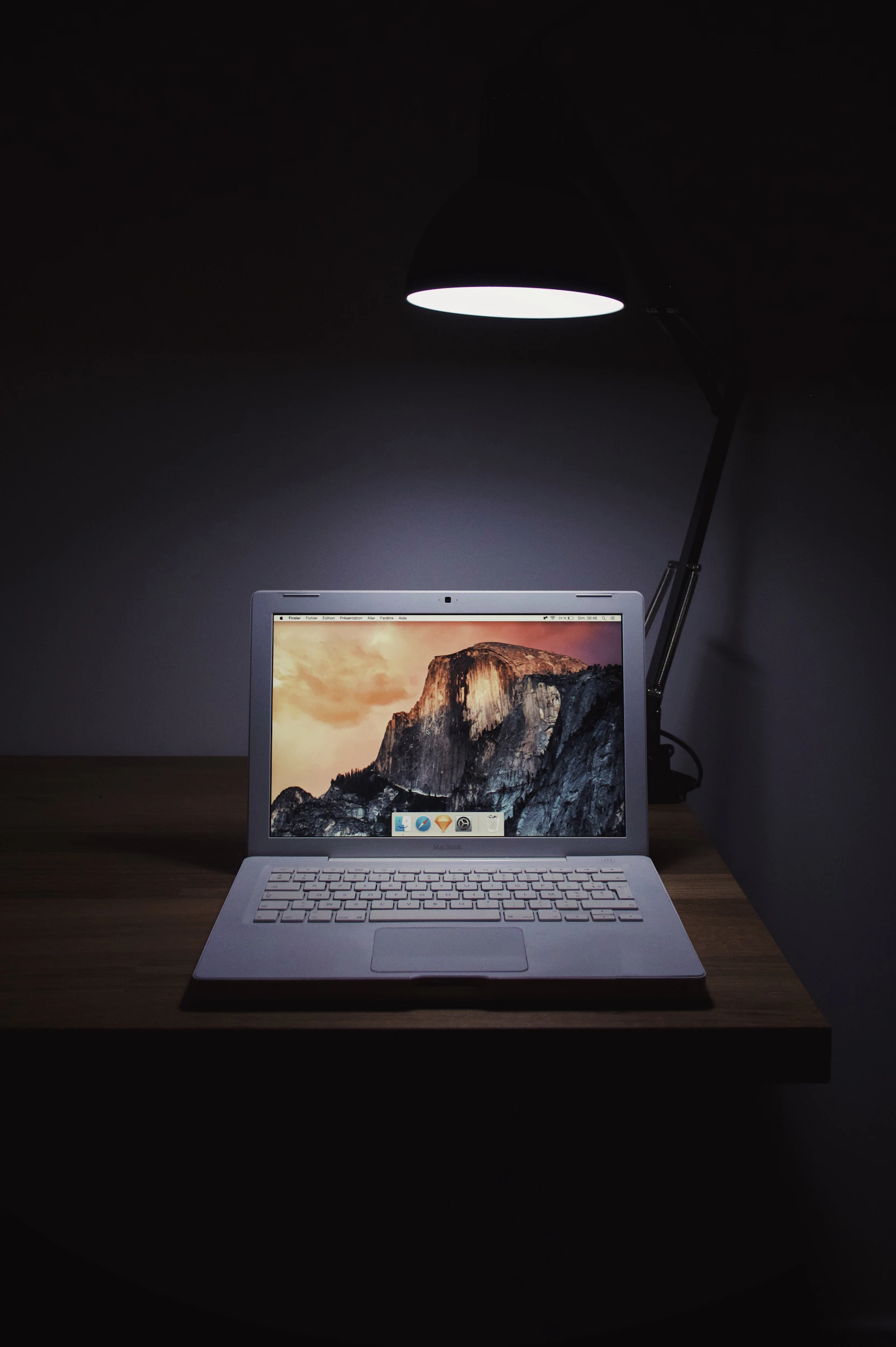A closed MacBook Air on a wooden surface