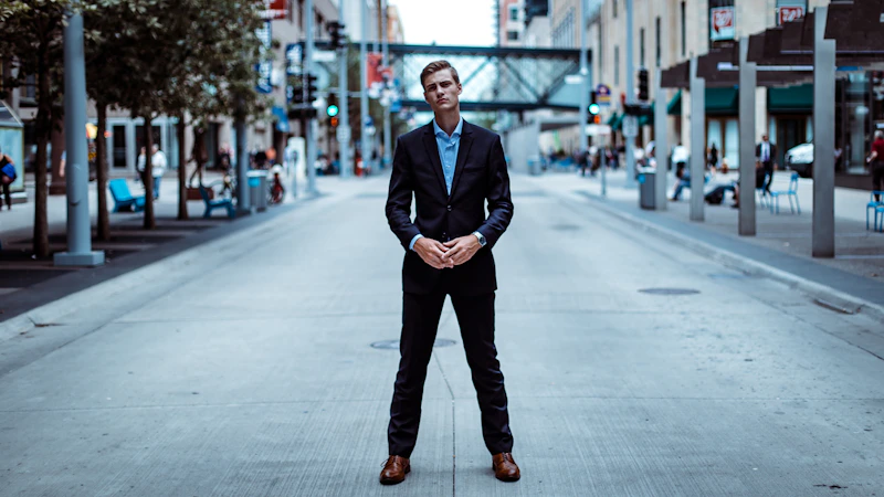 man standing in the middle of the road