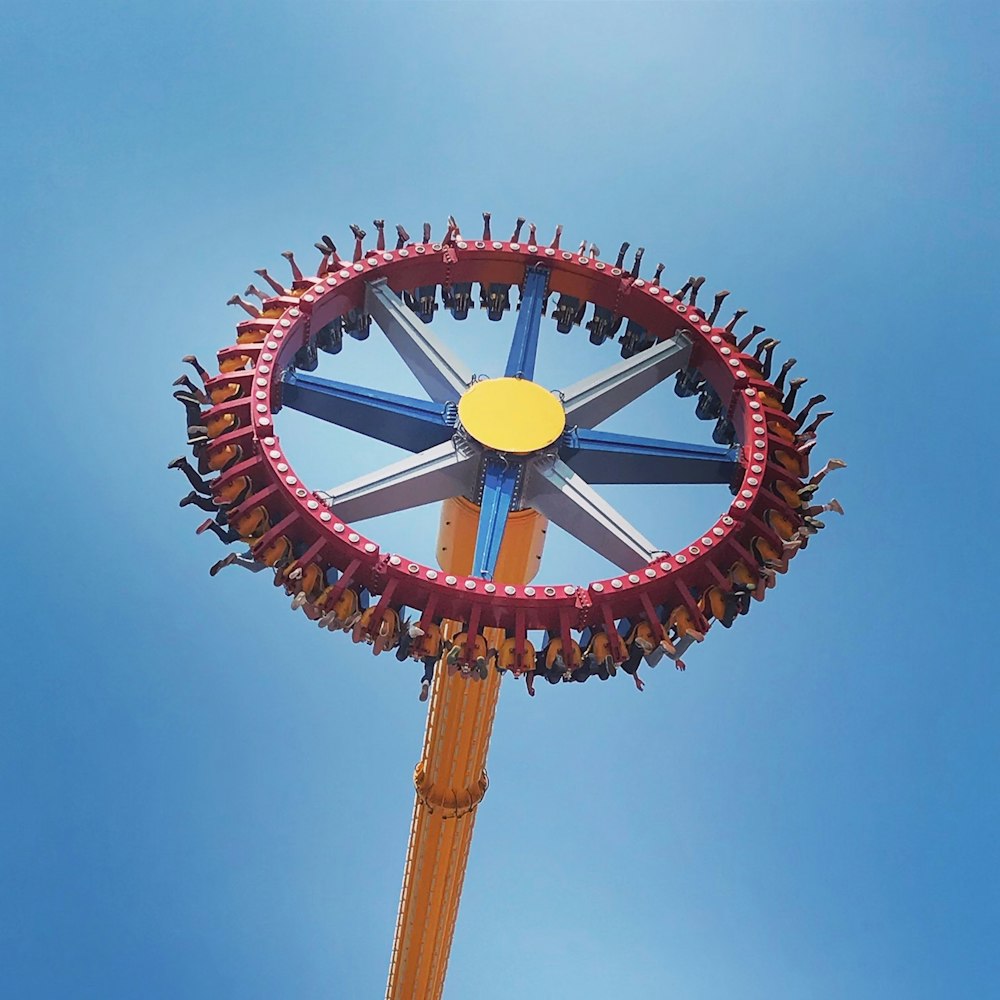 brown and white ferris wheel under blue sky during daytime